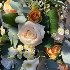 Peaches and Cream casket spray