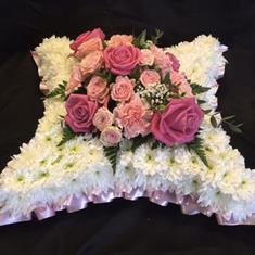 Cushion in pink and cream