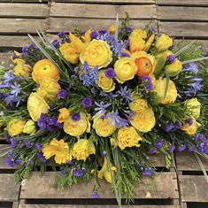 Gold and Purple Casket spray