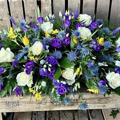 Purple and cream Casket spray
