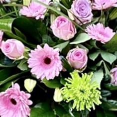 A florist choice Pink and Green Casket spray