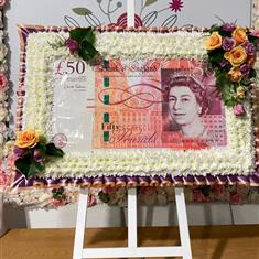 Fifty pound note on a easel