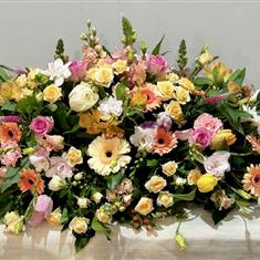 Pastel casket spray