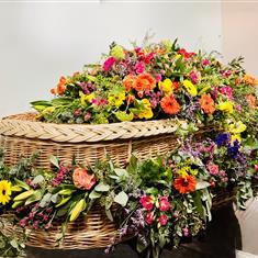 Vibrant Casket spray and Garland