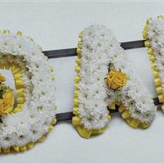 Classic tribute with a choice of foliage or ribbon